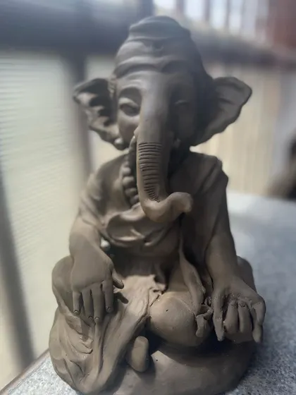 Every Ganesha idol is unique, just like the person who makes it. Here are a few different idols sitting side-by-side, each with its own personality and charm.