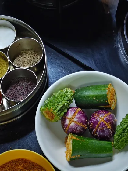 Getting ready to make Bharlela Vanga (stuffed eggplant). My masala box is always by my side, holding all the essential spices for my Kolhapuri cooking.
