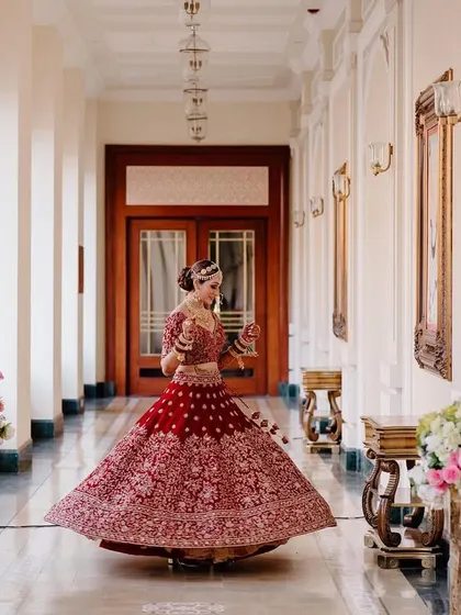 A bride's joyful twirl in the grand corridor of a palace hotel. This portrait captures the elegance, excitement, and fairytale feeling of her wedding day.