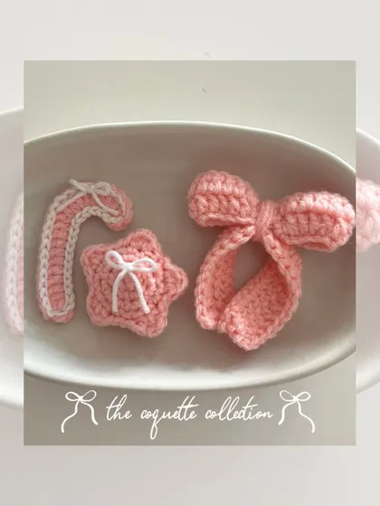 My "coquette collection" for the holidays, featuring a pink candy cane, a star with a tiny bow, and a signature large bow, all in a cute pink and white theme.