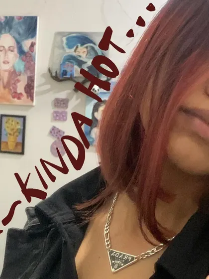 Kinda hot with this red hair. A close-up shot with a simple text doodle.