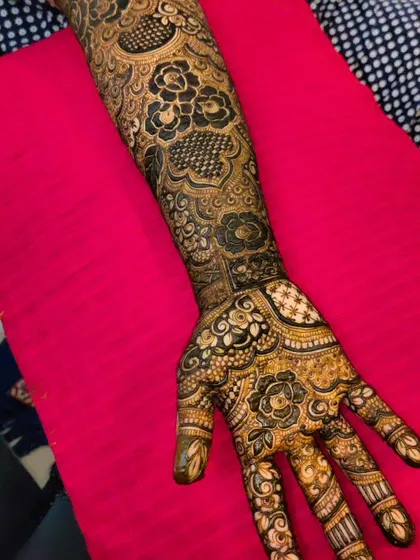 A close-up of the palm and wrist area of this intricate bridal design.
