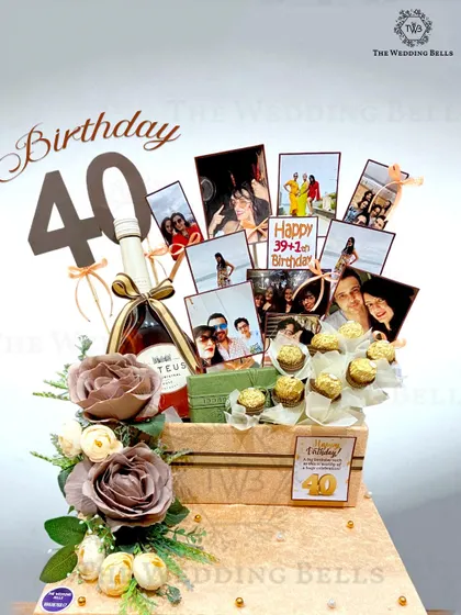Cheers to 40 fabulous years. This luxury birthday hamper was designed for a milestone celebration, featuring a bottle of wine, ferrero rocher bouquet, and a collage of memories.