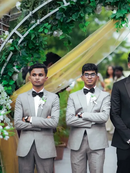 A candid shot of the groomsmen waiting for the ceremony to begin. We document the supporting cast of your wedding day story.