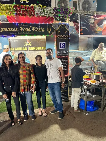 A family enjoying the live cooking stations and the exciting atmosphere of our food fiesta.