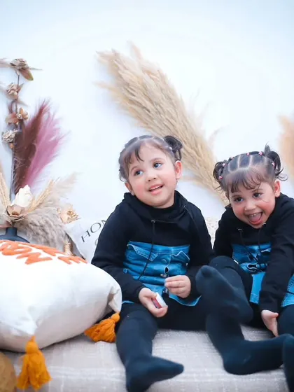 More smiles and laughter from the twin sisters in our cozy studio. We let them play and capture the magic as it happens.