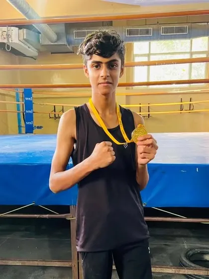 Krishna Singh, our U19 gold medalist, proudly displays his achievement.