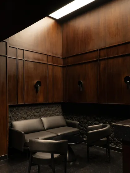 A collection of atmospheric shots from Lair, showcasing the interplay of black concrete, glass blocks, polished steel, and dramatic lighting. Each image captures a fragment of the bar's mysterious and immersive character.