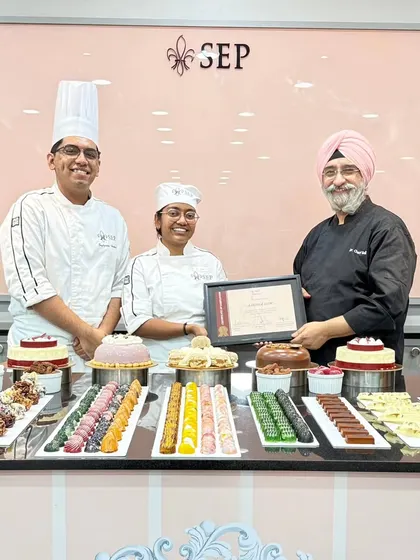 Another proud moment from my graduation, receiving my certificate. The table is filled with all the beautiful pastries and cakes we learned to create during the course.