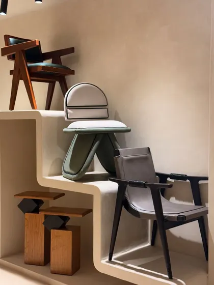 A variety of our chair designs on display, showcasing different forms, materials, and woodworking techniques. From angular to curved, each chair has its own unique character.