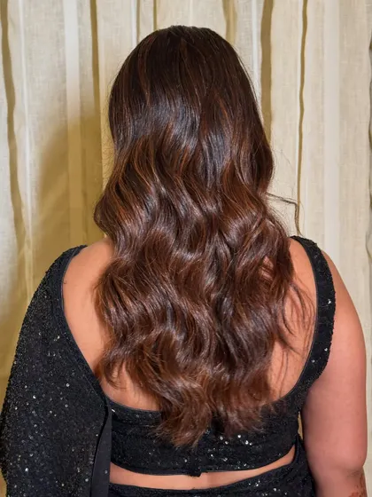 A shot of the beautiful, wavy hairstyle for the cocktail event.