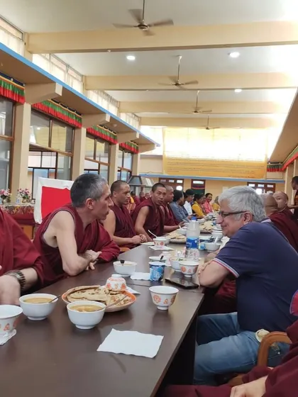 A candid moment of our teachers and community members sharing a meal together at the monastery. These informal gatherings are a cherished part of our spiritual journey, fostering connection and dialogue.
