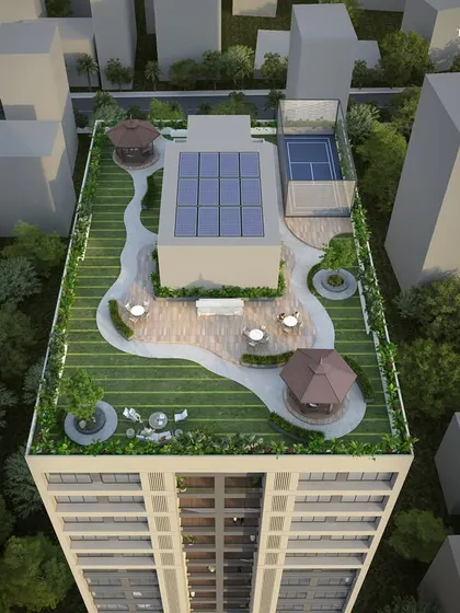 The rooftop terrace of a residential development in Mumbai's western suburbs. This intelligently planned space includes a paddle tennis court, solar panels, and shaded gazebos, transforming a compact plot into a hub of activity and relaxation.