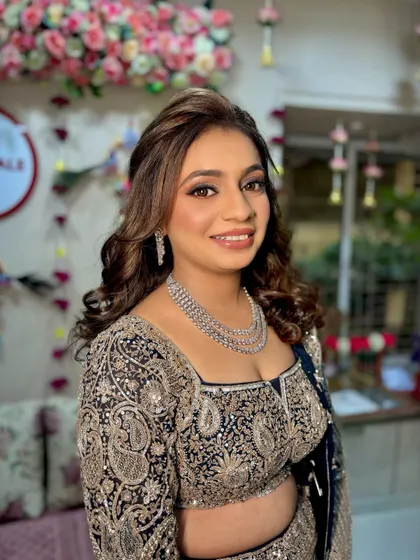 A happy and confident portrait of the bride, ready for her sangeet night in a full glam look.
