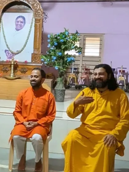 A candid moment during the inauguration of the Yoga Volunteers Course at Mata Amritanandamayi Ashram. Collaborations like these help build a wider, more connected yoga community.