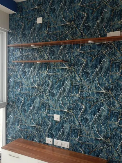 A deep blue textured wallpaper with a gold geometric line pattern.