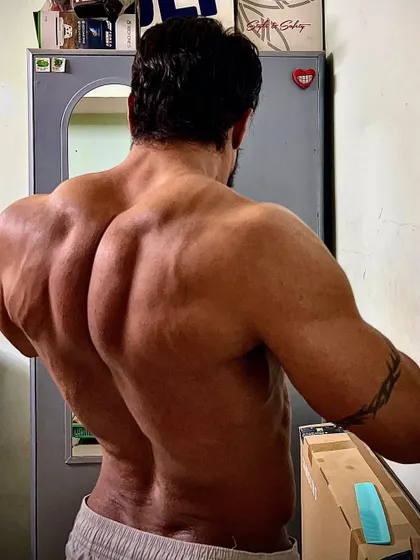 A different back pose, showing the width and thickness of my lats and lower back.