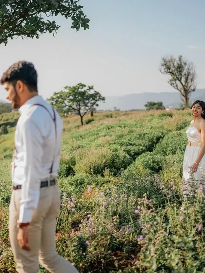 A candid moment of him walking ahead while she follows with a smile. It tells a story of leading and following each other through life.