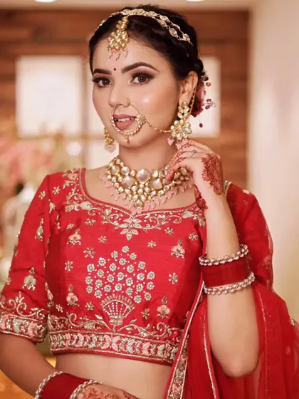 A beautiful close-up of a bride, focusing on her elegant makeup and kundan jewelry.