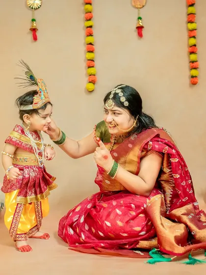 A playful interaction between mother and child, as Yashoda lovingly teases her little Kanha.