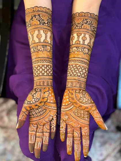 Another view of a full-coverage bridal design with repeating bands of patterns. The consistency and detail create a beautiful, flowing look up the arms.