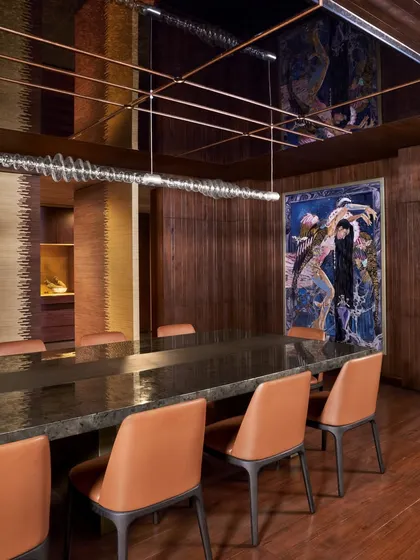 The dining room at the Baid Residence, featuring a Red Dot Award-winning light from Rossana Orlandi and captivating artwork by Shilo Shiv Suleman. The space is designed for an elevated and artistic dining experience.