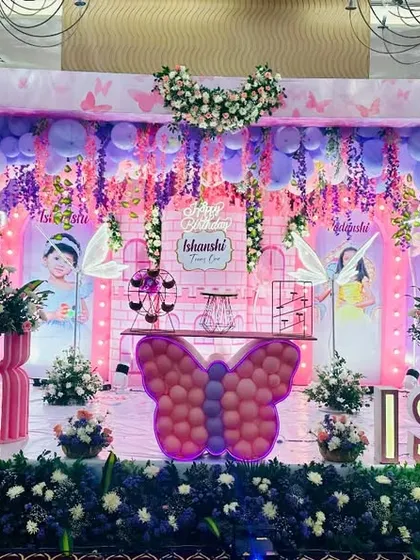 A closer view of the enchanted butterfly stage, highlighting the personalized backdrops and intricate details.