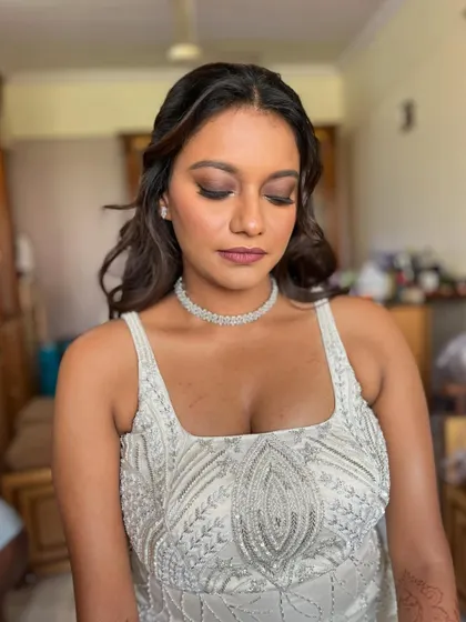 A close-up of the eye makeup, showing the soft purple tones and subtle glam. The look is ethereal and classic.