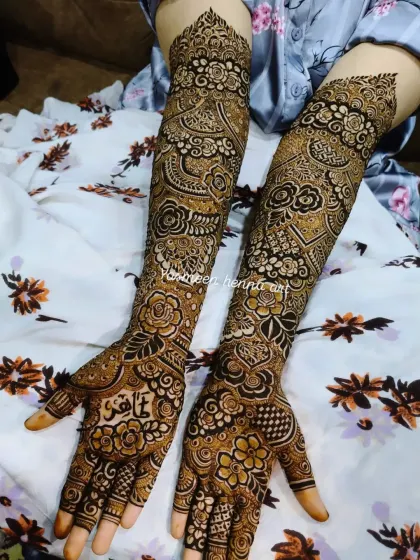A classic bridal design with a modern twist. The patterns are traditional, but the placement gives it a contemporary feel.