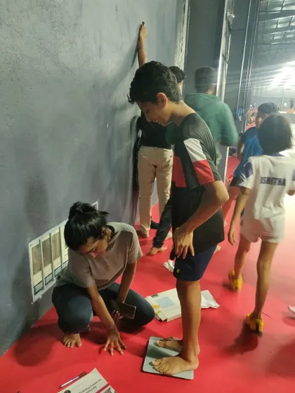 Conducting routine height and weight checks for our young athletes to monitor their growth and development.