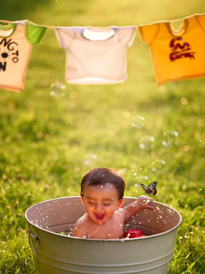 Splish, splash, and a whole lot of laughs. The outdoor tub-time theme is one of my most popular shoots, capturing the pure, uninhibited joy of a baby playing in the water.
