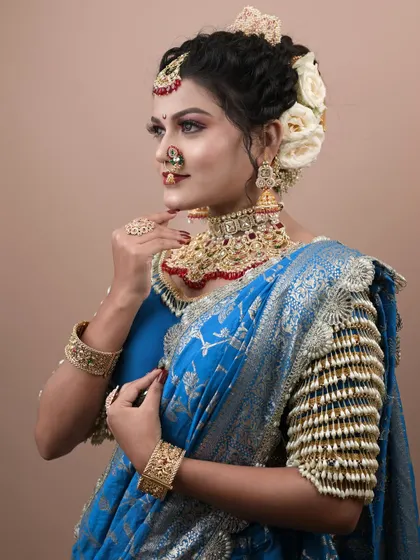 A profile view showcasing the beautiful hairstyle and the flawless makeup application.