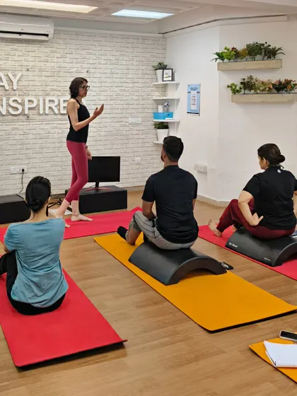 Using props like the spine corrector arc helps students feel the correct alignment. In this session, we are exploring how to use props to teach spinal mobility and core engagement.