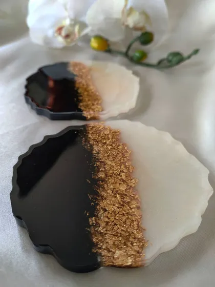 For a classic and timeless look, I created these geode coasters in black and white with a gold flake accent. They are perfect for a modern home decor style.