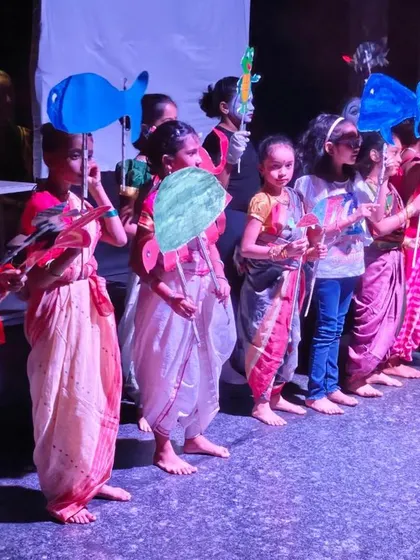 Our young performers line up with their handmade fish puppets for an under the sea themed scene. This shows how they learn to integrate prop work and performance, bringing their creative visions to life.