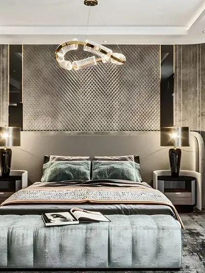 A luxurious master bedroom with a statement headboard featuring textured panels and mirror accents. The sophisticated lighting and high-end finishes create a hotel-like feel right at home.