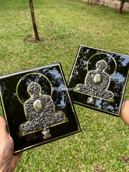 A pair of Mahaveer Swami artworks, ready to bring positive energy to their new homes. The combination of black, gold, and the natural texture of pyrite creates a powerful and elegant piece.