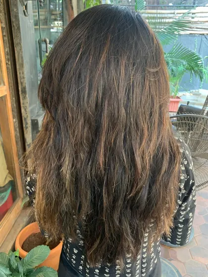 A before shot of a major transformation. This shows the starting point for our warm brunette look. (No filter)