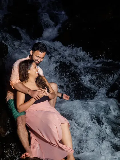 The couple shares a laugh in the rushing water. Our goal is to make you feel comfortable enough to be yourselves, resulting in genuine and happy photographs.