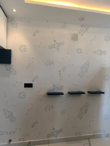 A minimalist space-themed wallpaper with line drawings of astronauts, planets, and rockets on a white background.