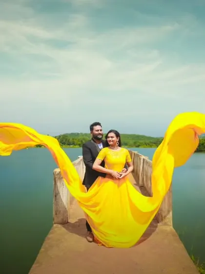 The yellow flying gown creates a spectacular wave-like effect in this shot, perfectly complementing the lakeside setting. This is a great way to add energy to your photos.