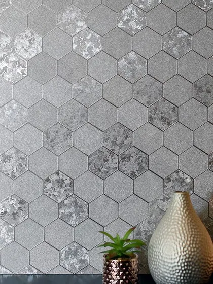 A very modern and stylish hexagonal tile wallpaper with a mix of textures, including metallic and stone effects. This is a great choice for a contemporary bathroom or kitchen backsplash area.