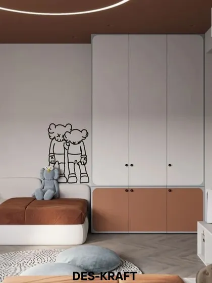 A playful yet modern kid's room using a warm terracotta and white color scheme. The custom wardrobe and fun wall decal add a personal and creative touch.