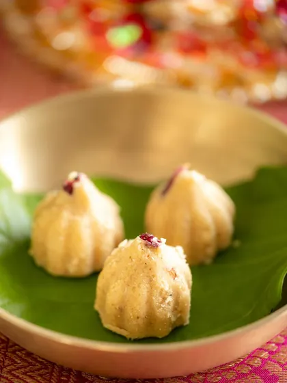 A close-up shot of homemade modaks, showcasing their texture and delicate details. This is an example of detailed food photography within a festive context.