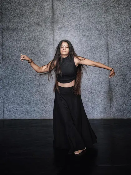 An open, expressive pose, inviting the viewer to feel the music and the movement with me.