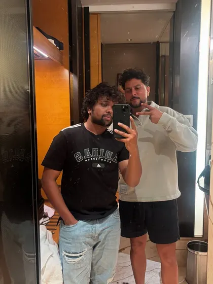A different pose with Kuldeep Yadav, showing the relaxed and friendly atmosphere of my sessions.