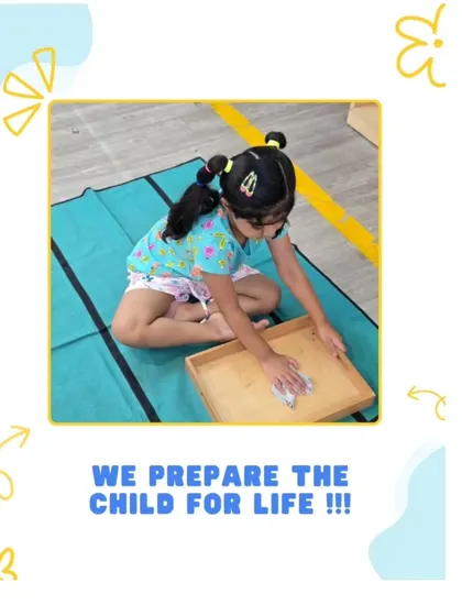 We prepare the child for life by instilling a sense of order and responsibility. This child is learning to care for her environment by cleaning a tray, an activity that builds concentration and respect for her surroundings.