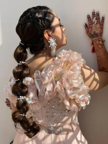 A candid shot showing the movement and detail of the balloon ponytail.