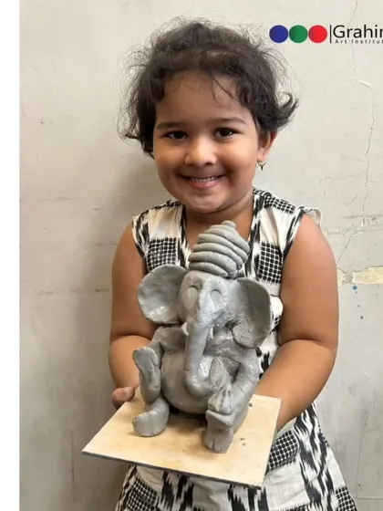 The proud smile of a young artist with her finished Ganpati idol from our workshop at Indoscots Global School. It is moments like these that make teaching so rewarding.