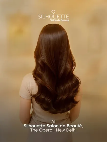 Rich, healthy-looking hair styled into voluminous waves. Our signature styling service is perfect for achieving that smooth, polished look, even in humid weather.